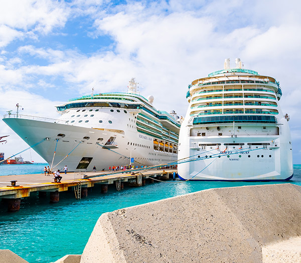 Royal Caribbean Cruise Line Serenade and Jewel Of The Seas ships docked in Philipsburg, Sint Maarten/ Saint Martin port. Passengers/ Tourists arrive for sunny island holiday.