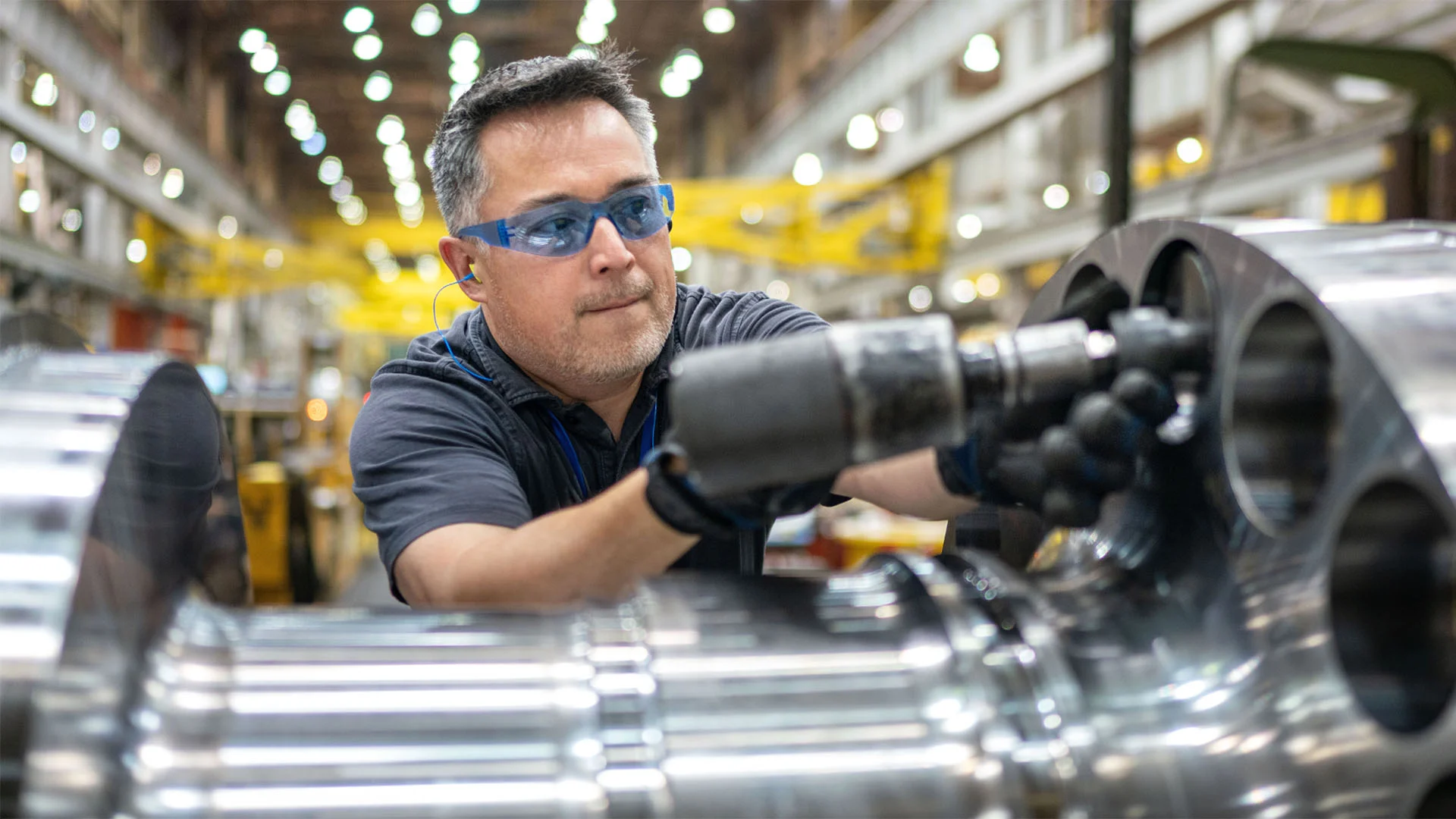 hero-man-wearing-safety-goggles-and-gloves-working-on-rotor.jpg