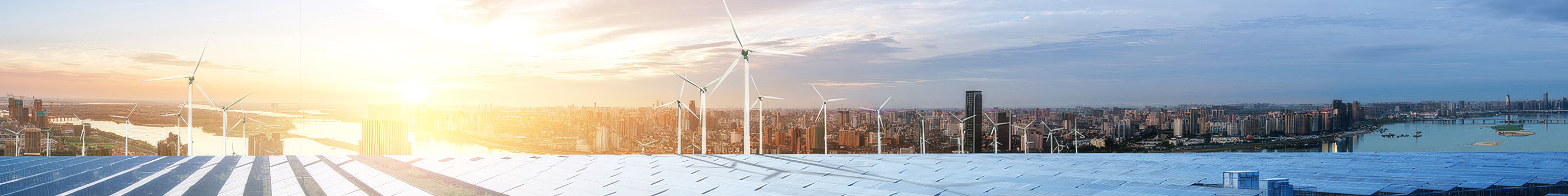 Cityscape with wind turbines and solar panels at sunset symbolizing green energy