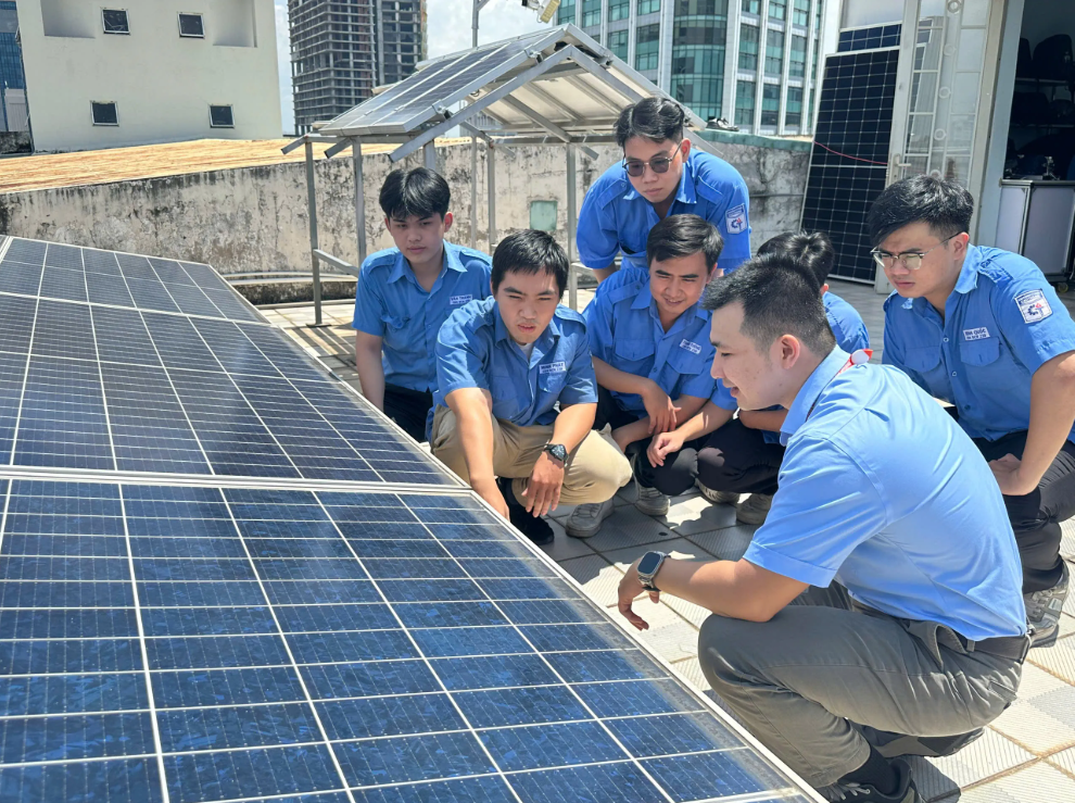 A group of students explore solar panels