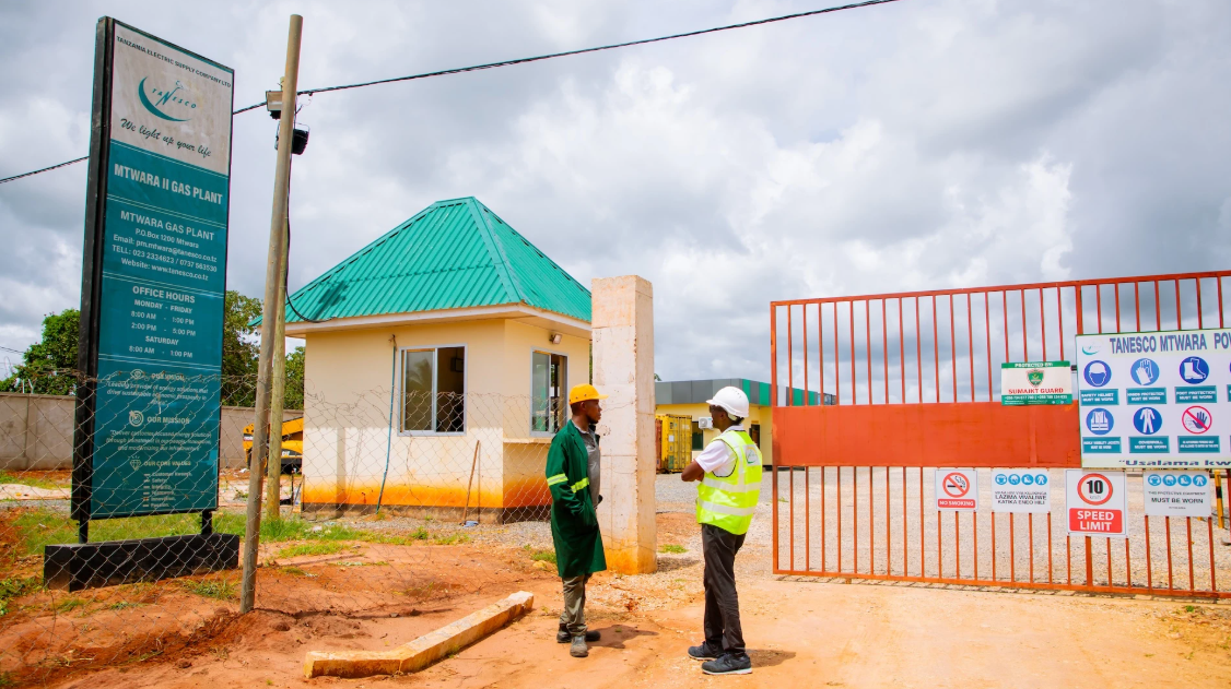 Two men talk in a site