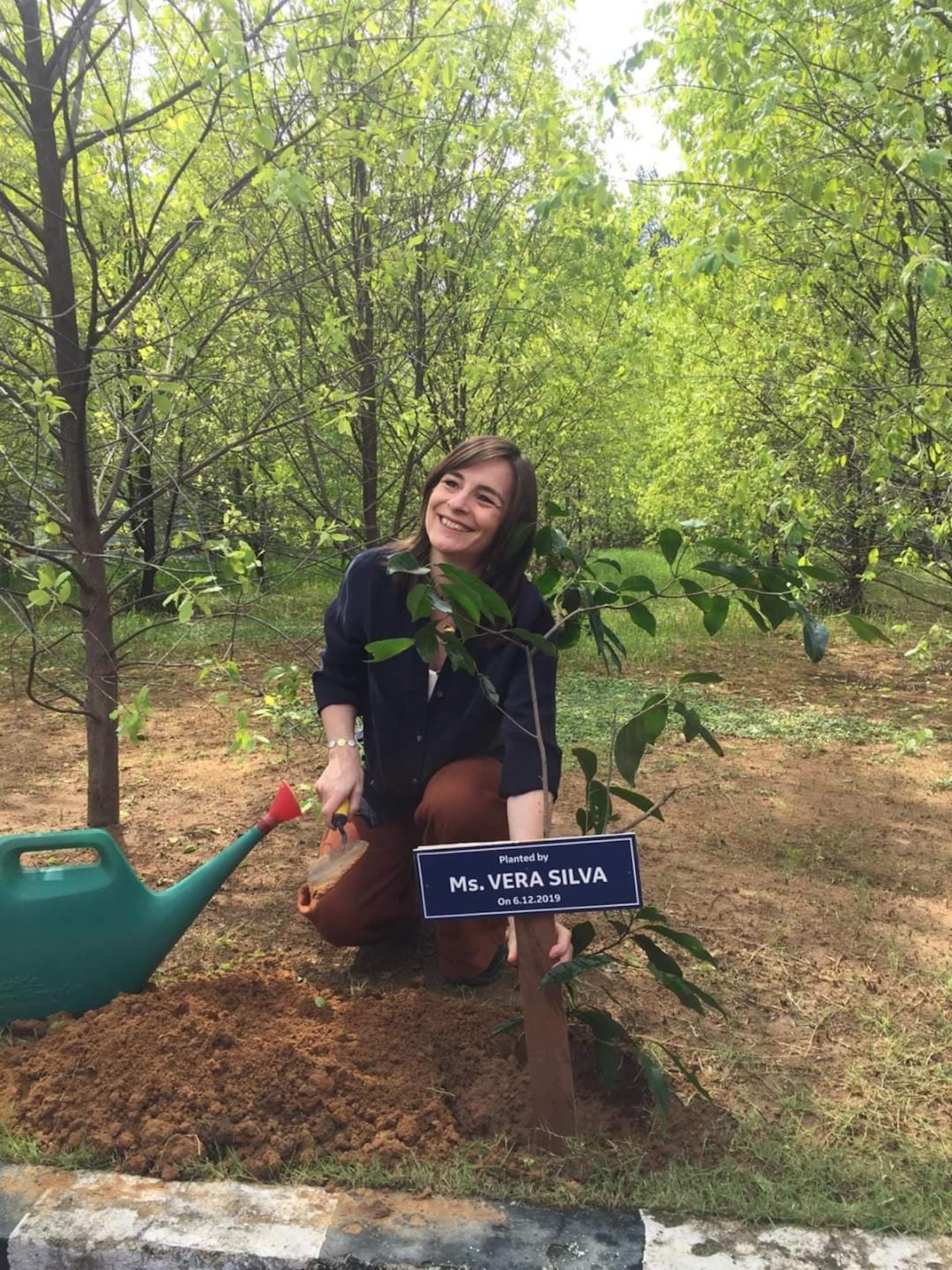 Vera Silver planting a tree