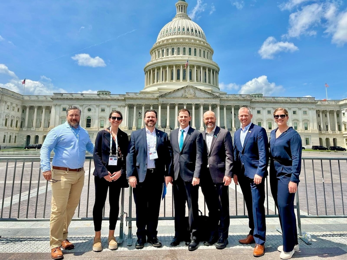 7 people posing outside the Hill