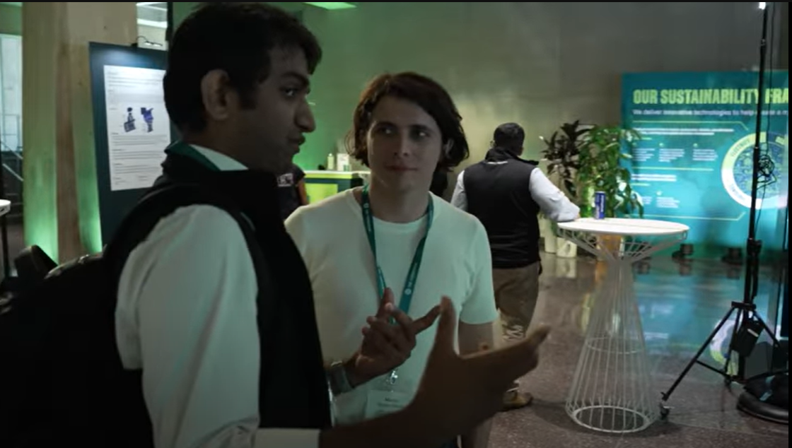 Two men chat during an event