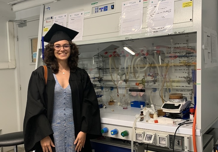 Silva's daughter at her lab bench on graduation day