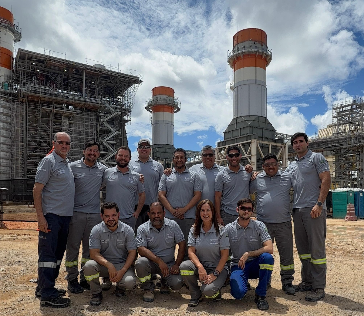 AzulÃ£o Iâs fieldwork team gather in front of the plant that they help make a reality