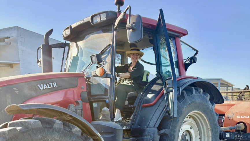 Woman in a big red tractor