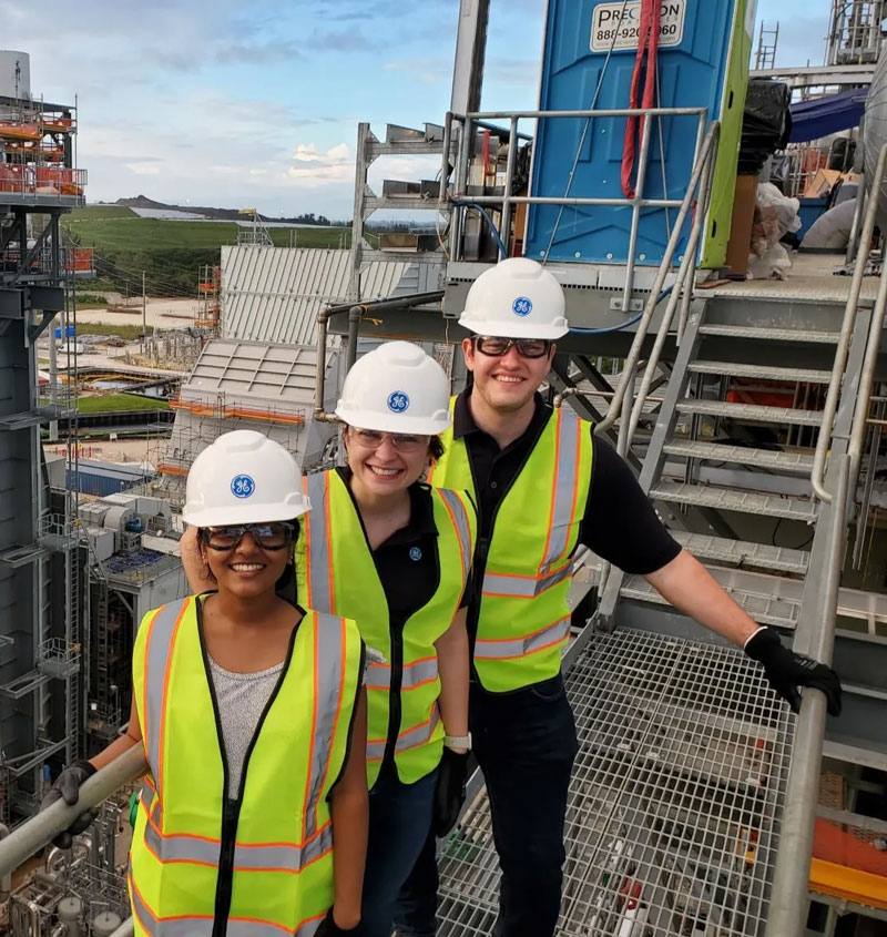 employees standing on stairs