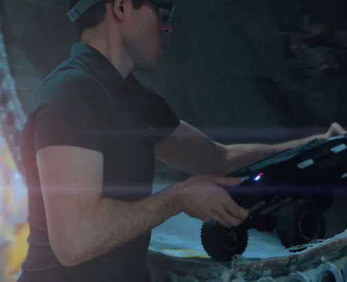 Man working with robot
